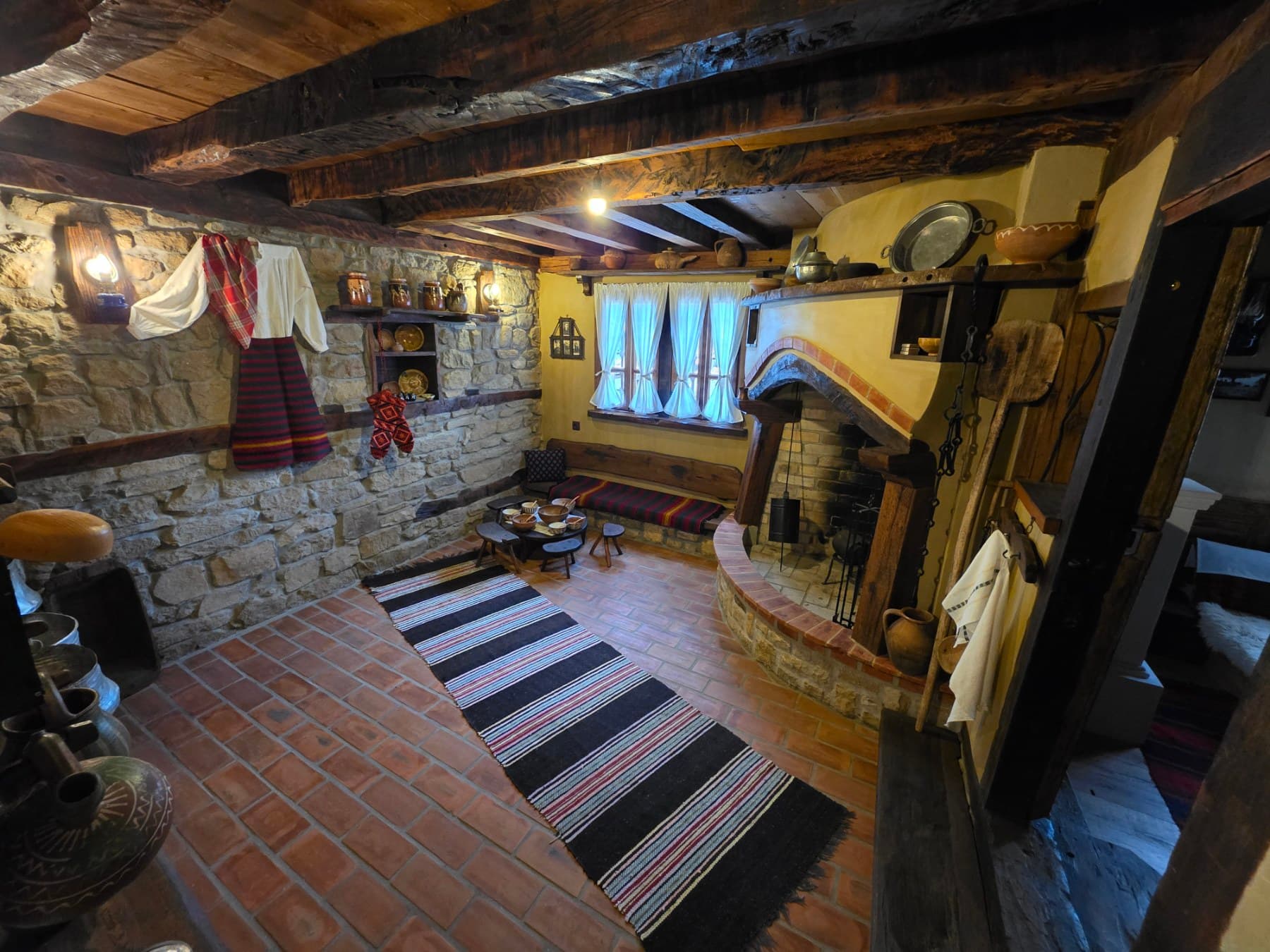 The hearth and stone walls of the old kitchen