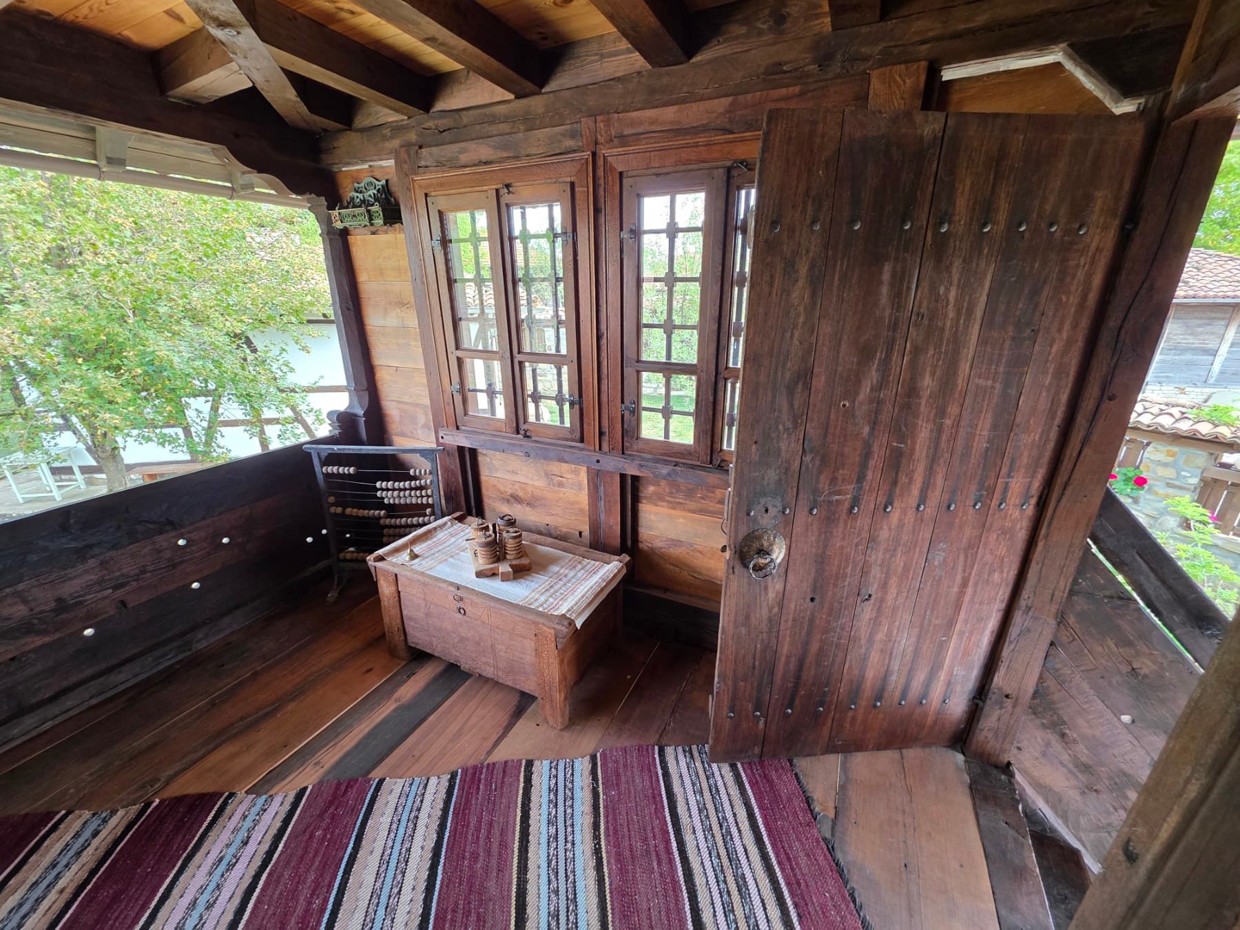 Wooden windows and a doorway on the veranda